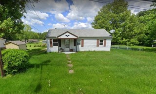 Stark Co. Ranch with 2 car garage on half acre